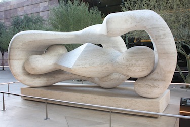 Abstract concrete sculpture of two people