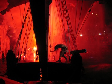 Pirate ship with red fire in background